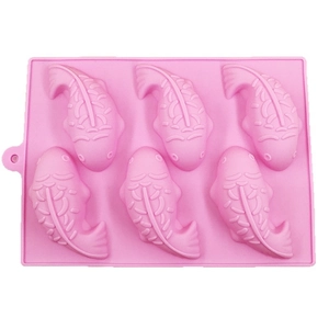 Pink 6-cavity koi fish silicone mold for chocolate and jelly DIY baking on white background
