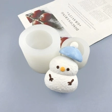 Macro detail of snowman silicone mold showing realistic texture and finished product