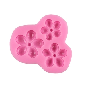 Pink silicone mold featuring three cherry blossom flower shapes for DIY baking and crafts