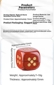 Macro shot of 15mm red jasper rounded dice with gold numbers and natural texture