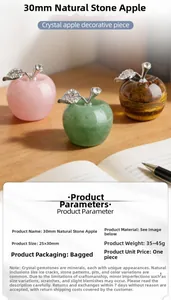 Detailed view of 30mm natural stone crystal apple with rhinestone leaf in a desk setting