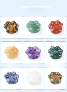 Collection of nine natural crystal cat paw carvings in diverse semi-precious gemstones
