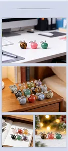 Mini natural crystal apple decor with silver leaf detailing on various backgrounds