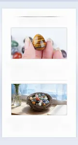 Close-up of polished 20mm natural tiger eye crystal egg in hand and bird nest decoration