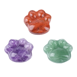 Natural crystal cat paw stones in red, purple and green colors on a clean white background
