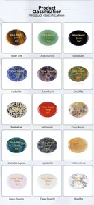 Macro detail of oval natural crystal stones with gold What Would Jesus Do engraving