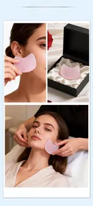 Pink rose quartz facial gua sha tool in a luxury black gift box with silk lining