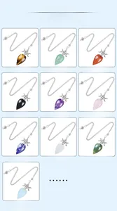 Macro view of ten varieties of pentagram crystal dowsing pendulums with silver chains