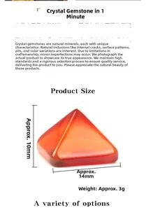 Macro shot of polished orange crystal pyramid showing 14mm base width and semi-transparent texture