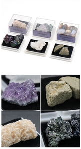 Macro view of assorted mineral crystals including amethyst and pyrite in display boxes