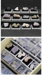 Detailed mineral specimen set with amethyst and crystals on black velvet bases in display boxes