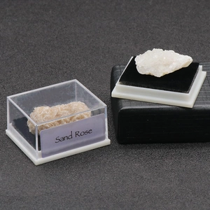 Natural desert rose mineral specimen in transparent acrylic display box with black base