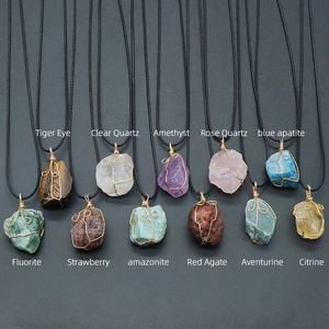 Natural raw gemstone pendant necklaces with golden wire wrapping on black woven cord