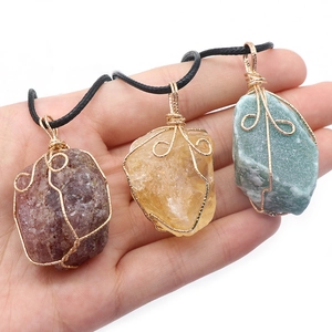 Three assorted natural raw gemstone necklaces with handmade gold wire wrapping