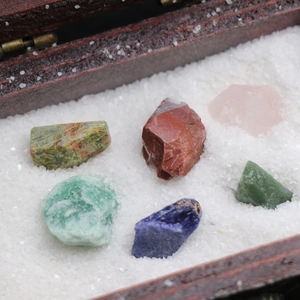 Natural mineral crystal stone collection set in a wooden box with decorative white sand