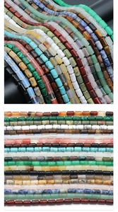 Detailed view of various cylindrical natural stone beads for DIY jewelry making