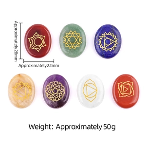 Set of 7 oval natural chakra stones with gold engraved totems for yoga healing