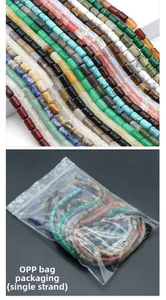 Macro detail of mixed natural stone cylinder beads for DIY jewelry with OPP bag packaging