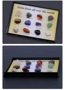 Macro detail of 12 natural crystal specimens in a black display tray with English labels