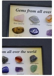 Macro view of twelve polished natural gemstone specimens in a labeled display box