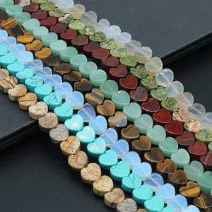 Assorted heart-shaped gemstone beads for DIY jewelry including tiger eye and turquoise