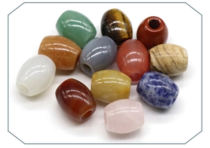 Close-up of assorted natural semi-precious stone barrel beads for jewelry making