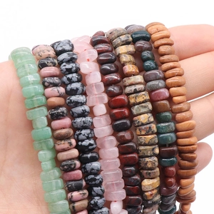 Various natural stone beads in flat disc shapes like aventurine and rose quartz