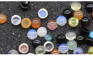 Macro shot of colorful semi-round gemstone cabochons for DIY nail art and jewelry making