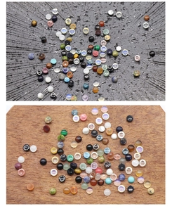 Detailed view of polished agate and crystal cabochons in various natural stone colors