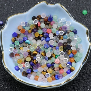 Polished round agate and crystal cabochon mix for DIY jewelry making in a blue bowl