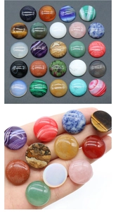Macro display of diverse round natural stone cabochons with polished flat backs
