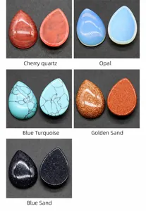 Macro shot of various teardrop-shaped natural stones and synthetic gemstone beads