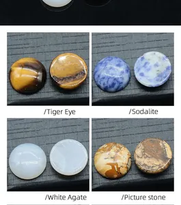 Macro view of 18mm round natural stones including Tiger Eye and Sodalite for DIY jewelry