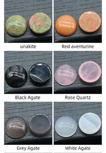 Macro shot of six types of polished natural crystal cabochons on black display