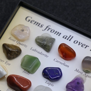Polished natural crystal set featuring tiger eye and quartz in a labeled display box