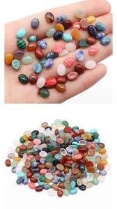 Macro shot of assorted oval cabochon semi-precious stones for jewelry making