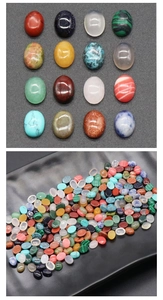 Macro shot of assorted oval cabochon gemstones for jewelry making and DIY crafts