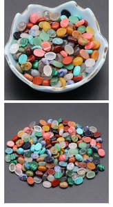 Macro shot of assorted oval polished gemstone cabochons for DIY jewelry making and setting