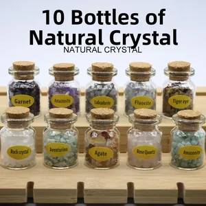 Set of 10 natural gemstone chips in glass bottles with cork on wooden display stand