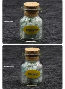Detail view of small glass vials with cork stoppers containing Green Aventurine and Amazonite