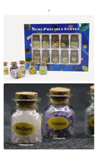 Set of 10 mini glass jars containing various natural crystal gemstones in a gift box