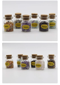 Macro detail of various natural crystal gemstone chips in corked glass bottles with labels