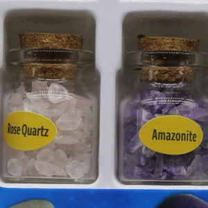Crystal gemstone specimens in glass bottles with cork stoppers for home decor and education