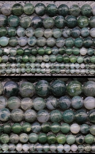 Macro detail of natural moss agate beads with deep green textures for DIY jewelry making