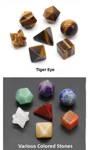 Detailed macro view of geometric Tiger Eye and colorful crystal yoga stone set
