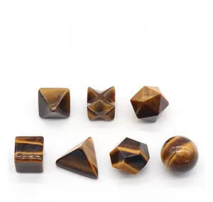 Macro shot of 7 geometric Tiger's Eye stones with distinctive golden-brown chatoyant luster