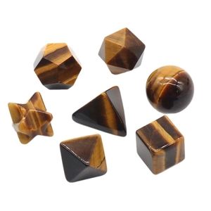 Tiger Eye stone set of 7 geometric polyhedrons for yoga and meditation on white background