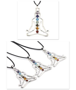 Detailed close-up of Chakra healing pendant with seven colorful stones for yoga meditation