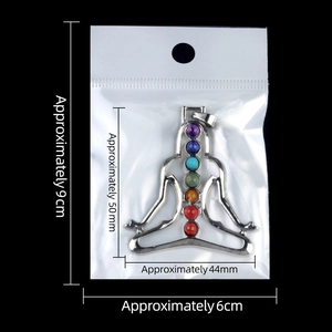 Chakra yoga meditation pendant with seven colorful gemstones on a black background