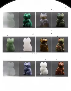 Macro shot of 12 carved cat figurines in various gemstones and healing crystals